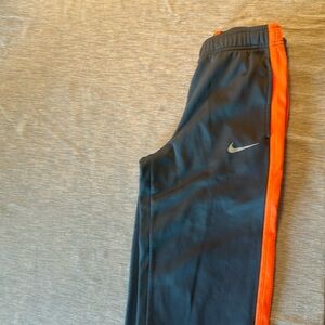 Grey and orange Nike sweat pants